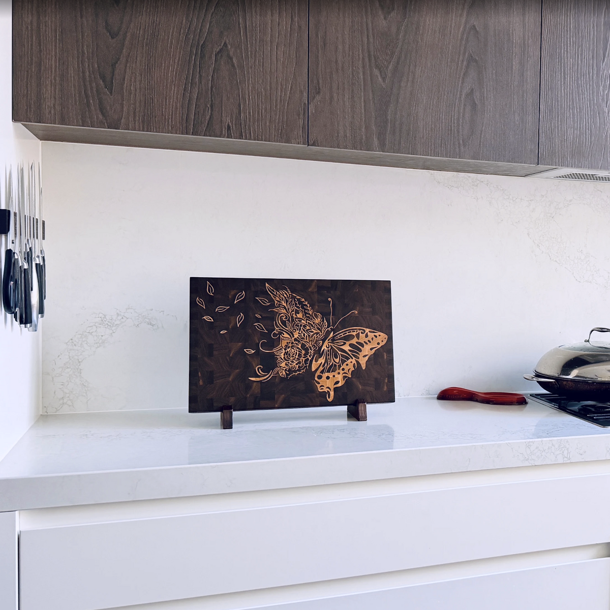 Handmade walnut cutting board with maple butterfly inlay